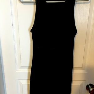 Wilfred Free black dress. Faux leather upper in the front. Form fitting.